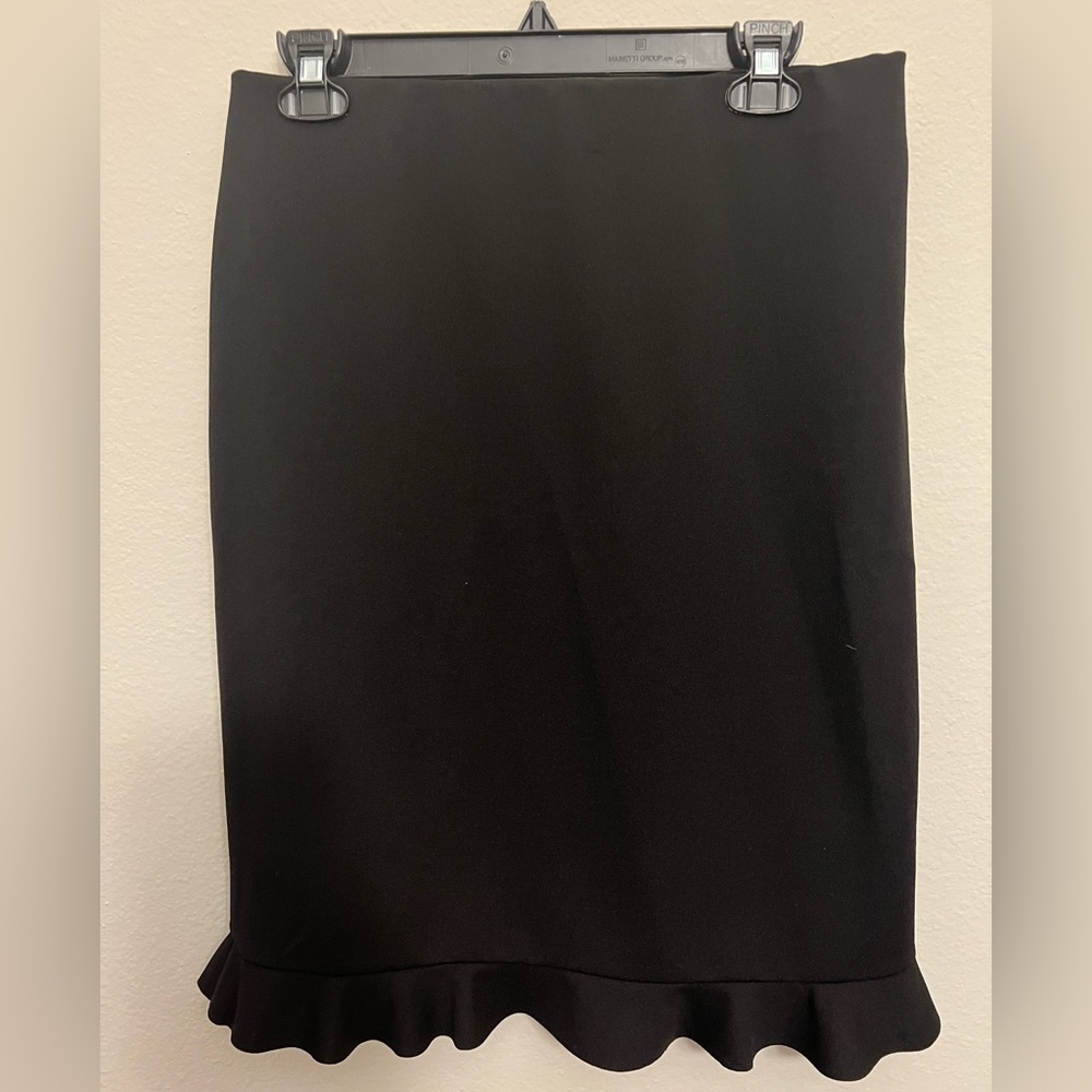 Black pencil skirt with ruffle on bottom.